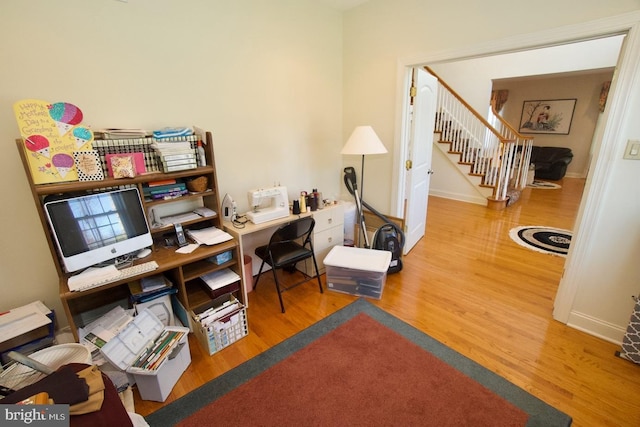 office area with wood finished floors and baseboards