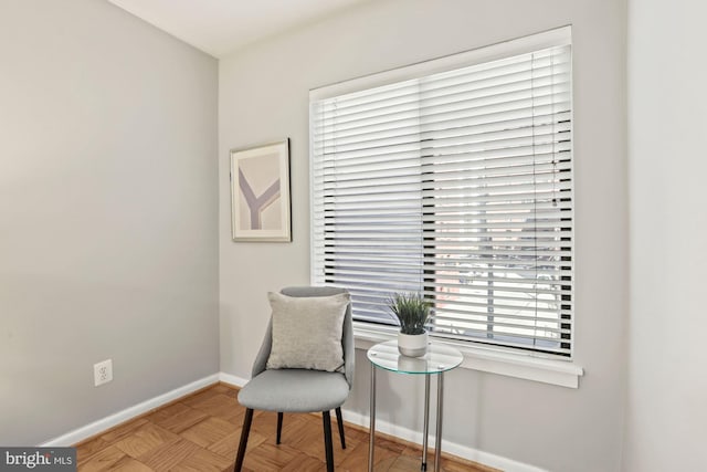 sitting room featuring baseboards