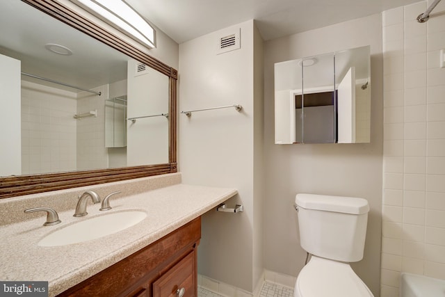 full bathroom with visible vents, toilet, and vanity