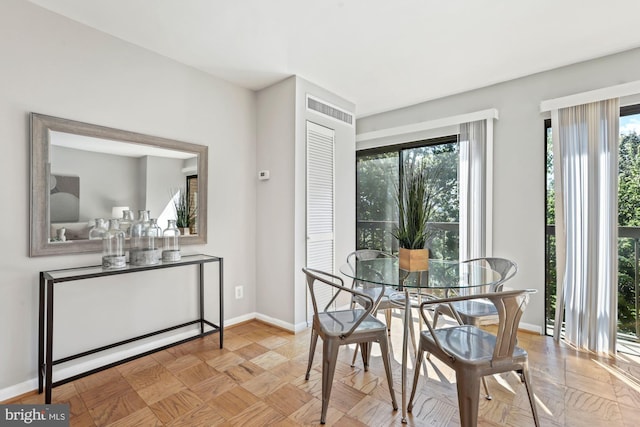 dining area featuring baseboards