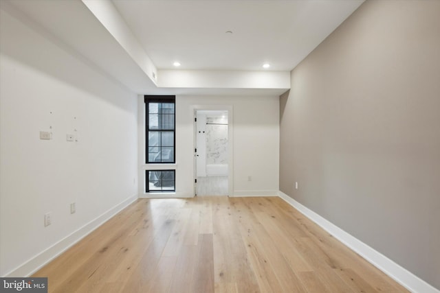 interior space featuring recessed lighting, baseboards, and light wood-style floors