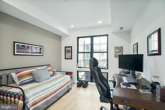 bedroom with visible vents, recessed lighting, and wood finished floors