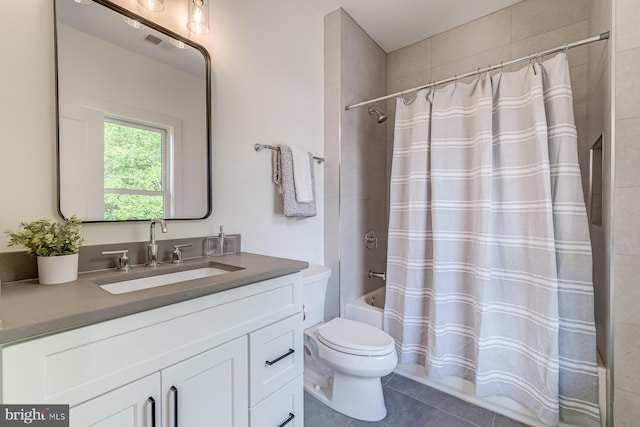 bathroom featuring tile patterned flooring, visible vents, toilet, shower / tub combo with curtain, and vanity