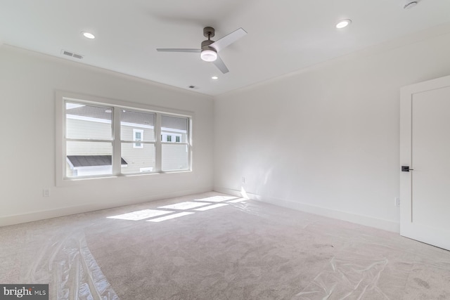 spare room featuring recessed lighting, visible vents, carpet flooring, and baseboards