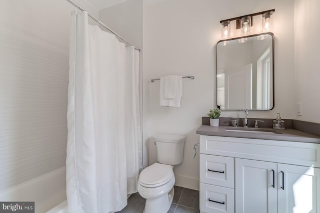 full bath featuring baseboards, toilet, vanity, and tile patterned flooring