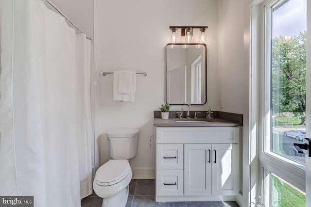 full bath featuring tile patterned floors, toilet, and vanity