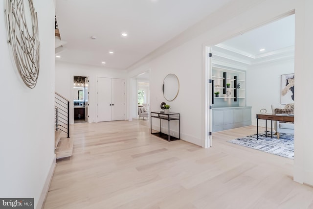 entryway featuring stairs, recessed lighting, wood finished floors, and ornamental molding