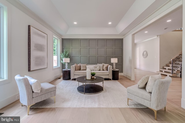 living room featuring stairway, recessed lighting, baseboards, and light wood-type flooring