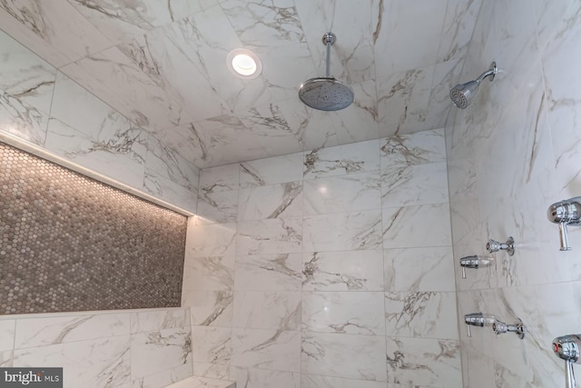 bathroom with tiled shower