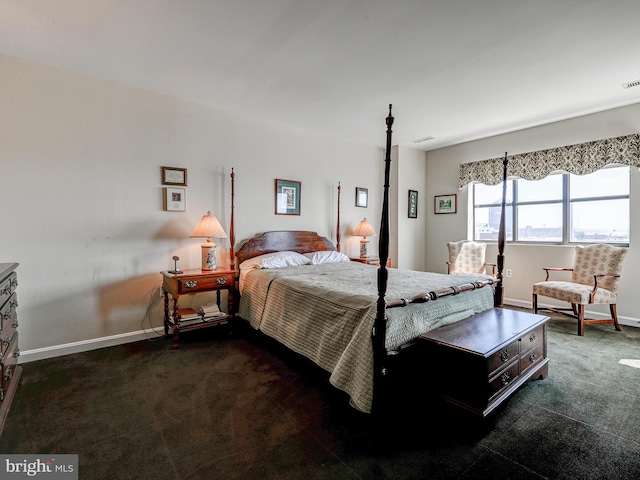 carpeted bedroom with visible vents and baseboards