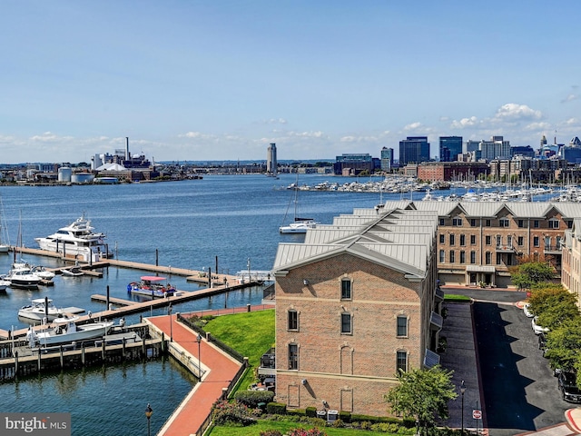 view of dock with a view of city and a water view