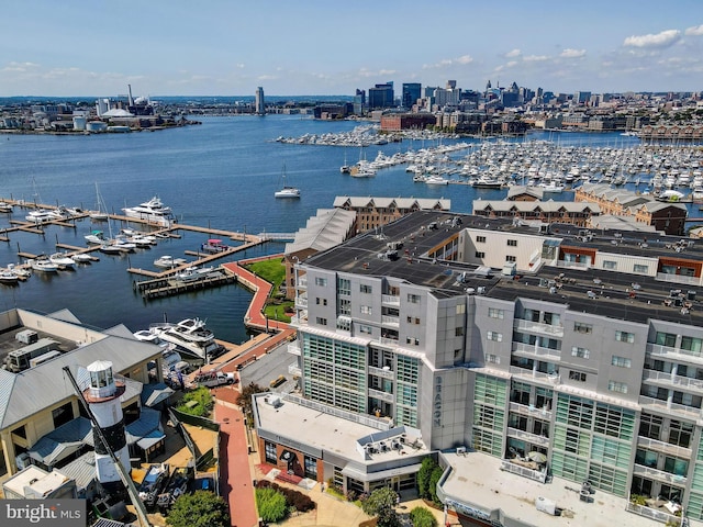 drone / aerial view with a city view and a water view