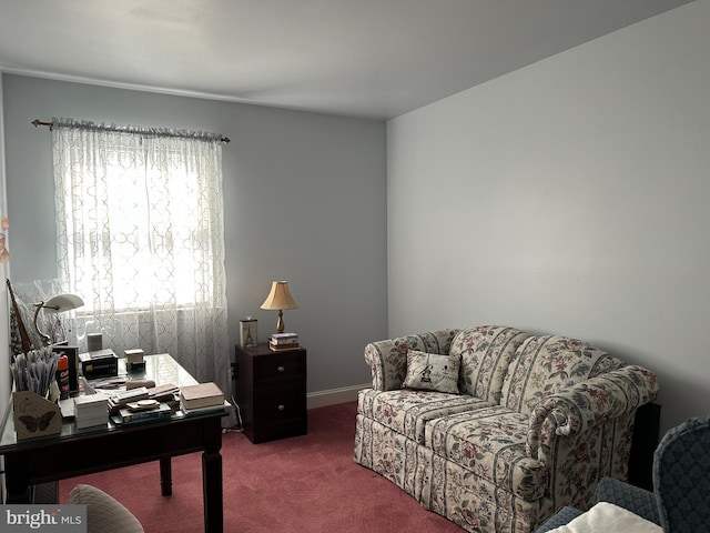 carpeted home office featuring baseboards