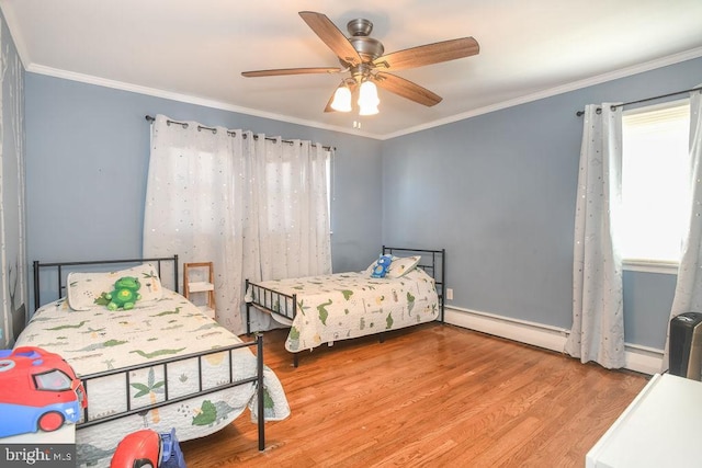 bedroom featuring ornamental molding, wood finished floors, ceiling fan, and a baseboard radiator