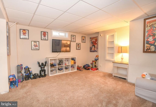 game room with carpet and a drop ceiling