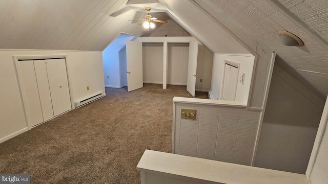 bonus room featuring a baseboard heating unit, a ceiling fan, carpet flooring, and vaulted ceiling