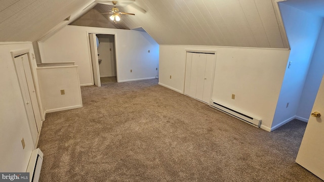 additional living space featuring a baseboard radiator, a baseboard heating unit, carpet floors, and vaulted ceiling