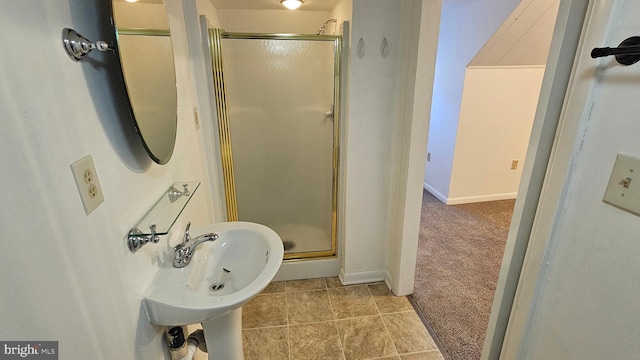 full bath with tile patterned floors, baseboards, and a stall shower