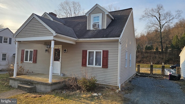 view of front of house featuring cooling unit