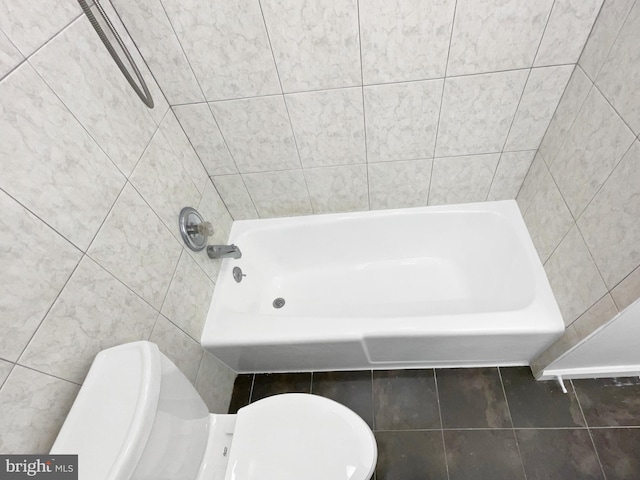 full bath with tile patterned flooring, a shower, tile walls, toilet, and a washtub