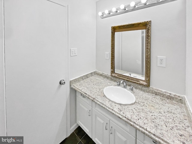 bathroom with tile patterned floors and vanity