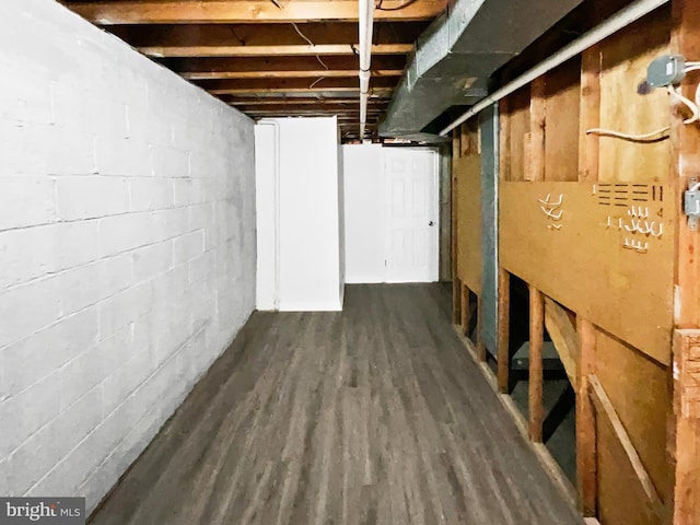 unfinished below grade area with dark wood-type flooring