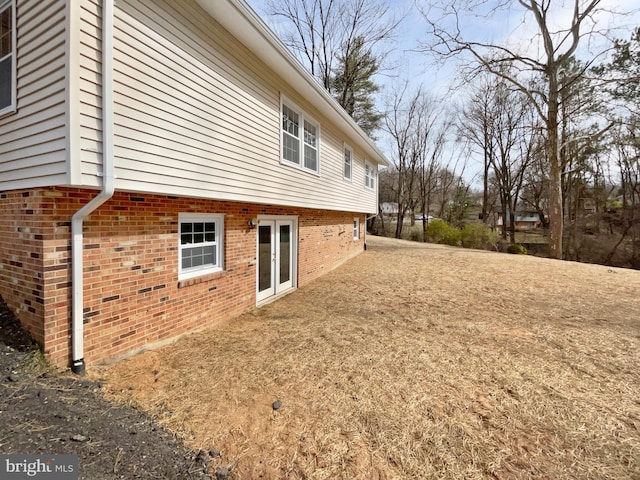 view of property exterior featuring brick siding