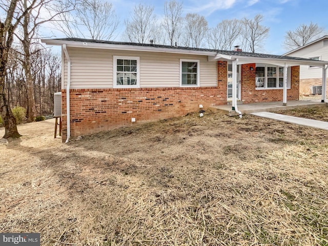 single story home with brick siding