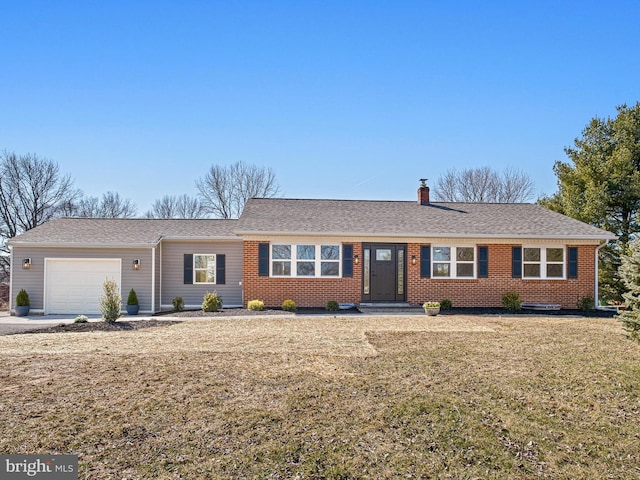 ranch-style house with a shingled roof, a front yard, an attached garage, brick siding, and a chimney