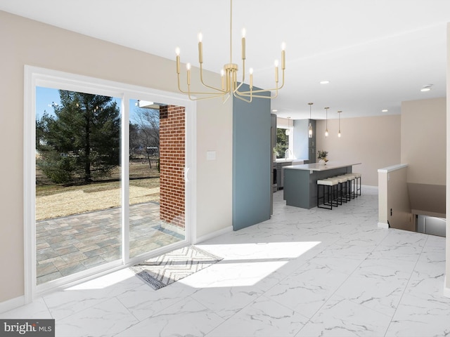 unfurnished dining area with recessed lighting, marble finish floor, and baseboards