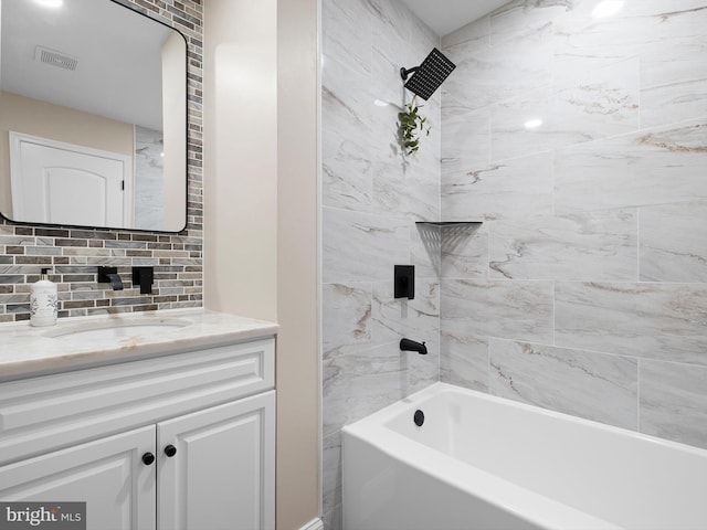 full bath with decorative backsplash, vanity, shower / bathing tub combination, and visible vents