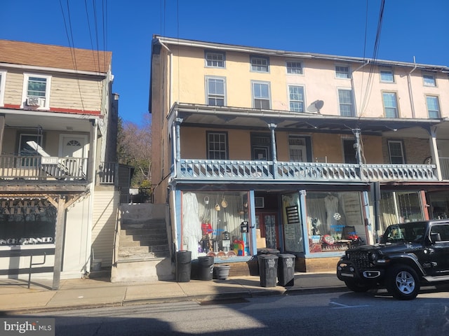 townhome / multi-family property with stairway and stucco siding