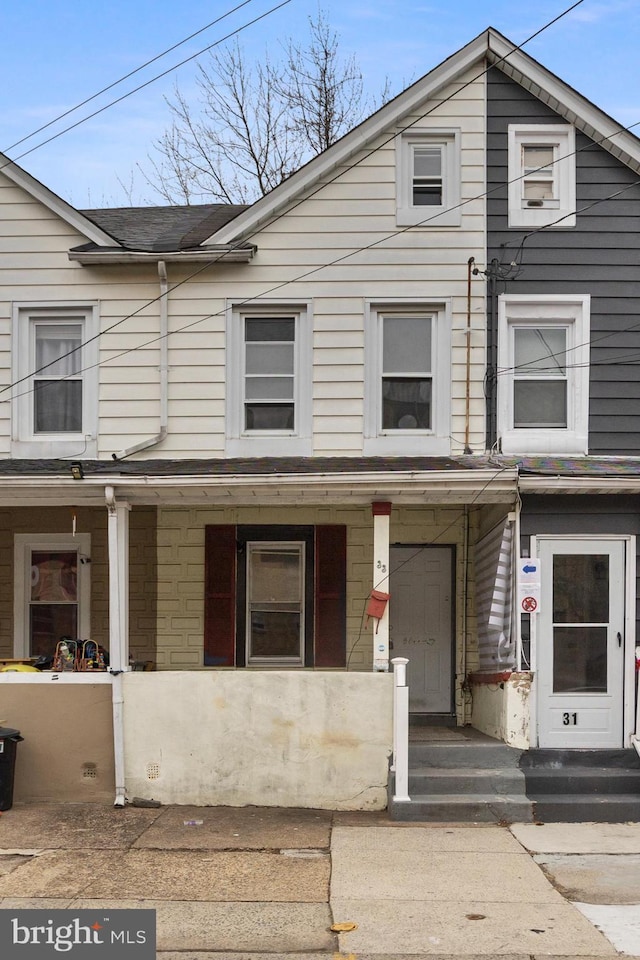 multi unit property featuring a porch