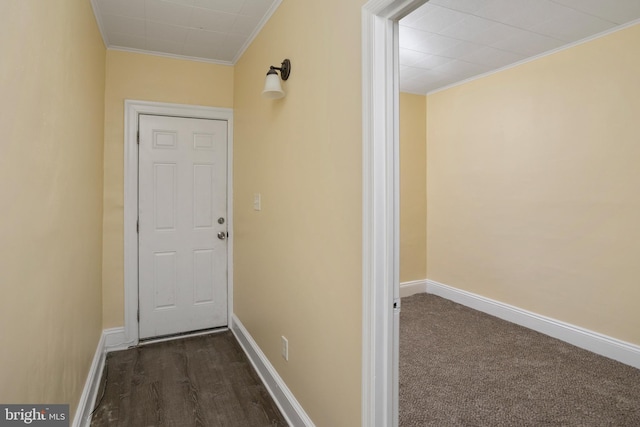 interior space with baseboards and ornamental molding