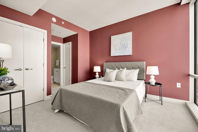 bedroom featuring carpet and baseboards