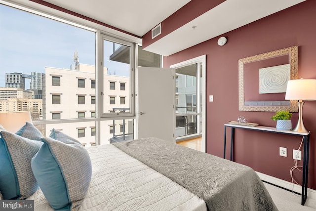 bedroom with carpet flooring, baseboards, and visible vents