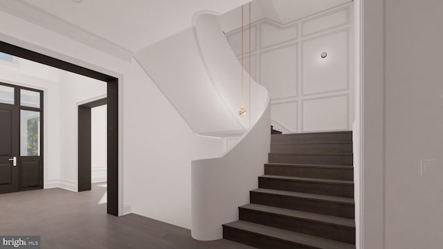 staircase featuring wood finished floors