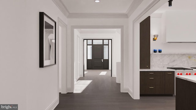 hall featuring baseboards, dark wood-style flooring, and ornamental molding