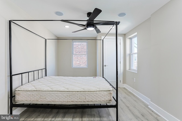 bedroom featuring baseboards, recessed lighting, a ceiling fan, and light wood finished floors