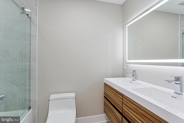 full bath featuring toilet, a sink, shower / tub combination, visible vents, and double vanity