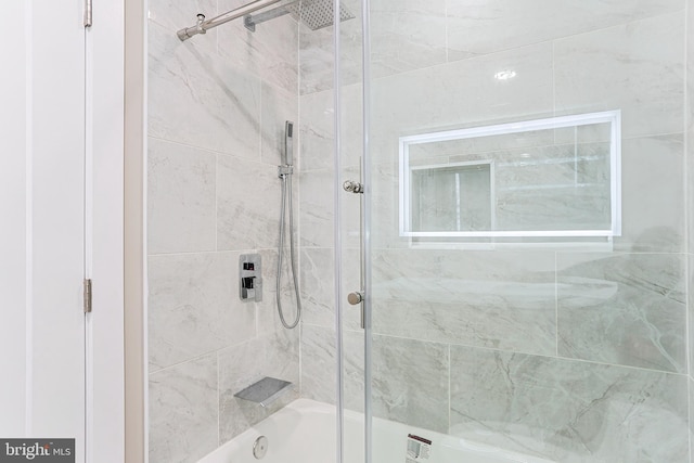 full bathroom with shower / bath combination with glass door