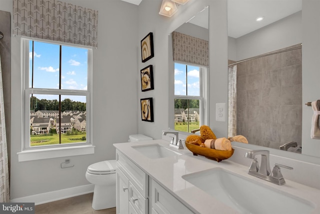 full bathroom with a sink, a shower with curtain, toilet, and double vanity