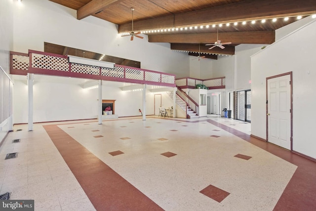 garage with wood ceiling and ceiling fan