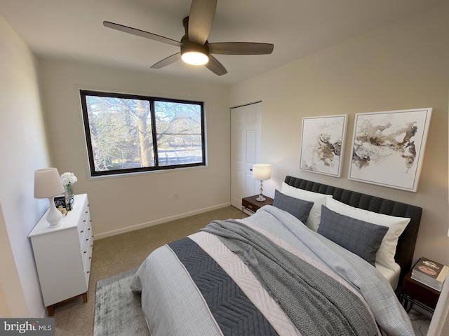 carpeted bedroom with baseboards and ceiling fan