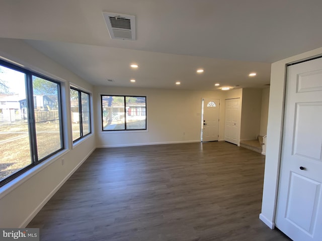 unfurnished room featuring recessed lighting, visible vents, baseboards, and dark wood finished floors