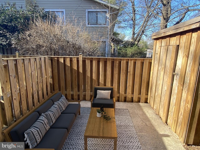 exterior space with an outdoor living space and fence