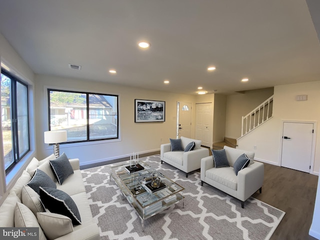 living room with visible vents, recessed lighting, stairway, baseboards, and dark wood-style flooring