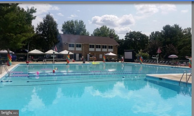 pool featuring a patio and fence