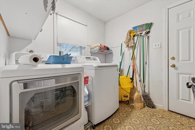 laundry area with washer and dryer, laundry area, and tile patterned floors