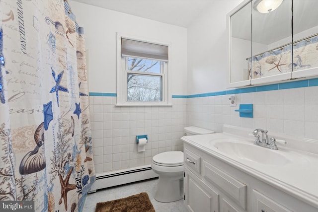 bathroom featuring vanity, tile patterned flooring, a baseboard heating unit, tile walls, and toilet